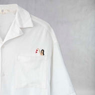 Fabric texture and button detail of ITIZ Breath shirt