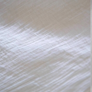 Close-up of the jacquard fabric texture of ITIZ Été pants