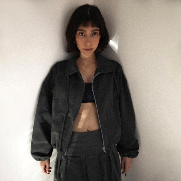 Front view of black ITIZ Tarantula coat from ITIZ × DollVovCinte collection
