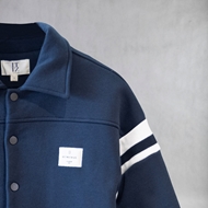 ITIZ Bluett Bomber Jacket close-up of button and logo patch