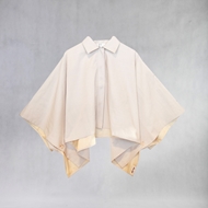 Front view of ITIZ Butterfly poncho in cream color, waterproof design, free size