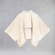back view of ITIZ Butterfly poncho in cream color, waterproof design, free size